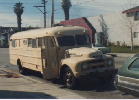 1968 Ford Mustang - This vintage school bus, likely from the late 1940s, is parked curbside with its door ajar.