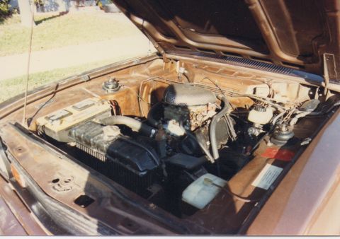 1968 Ford Mustang - Engine bay of a car, showing the engine, radiator, and battery.