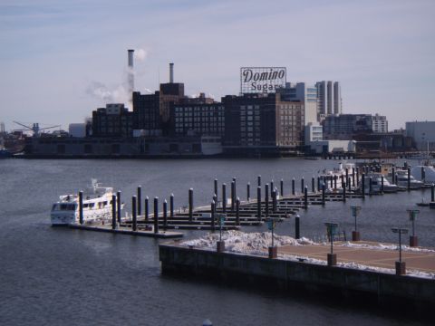2003 Jeep Wrangler - A view of a harbor with docked boats and the Domino Sugars industrial complex in the background.