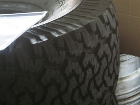 1986 Ford Bronco - This image shows a close-up of a tire tread, with the Supermotors.net logo visible in the lower right corner.