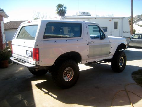 1996 Ford Bronco - This 1996 Ford Bronco features an aftermarket rear bumper and oversized tires, giving it a appearance.