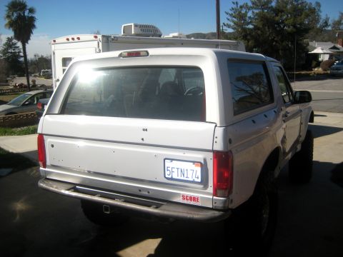1996 Ford Bronco - Rear view of a 1996 Ford Bronco, showing the bumper and license plate.