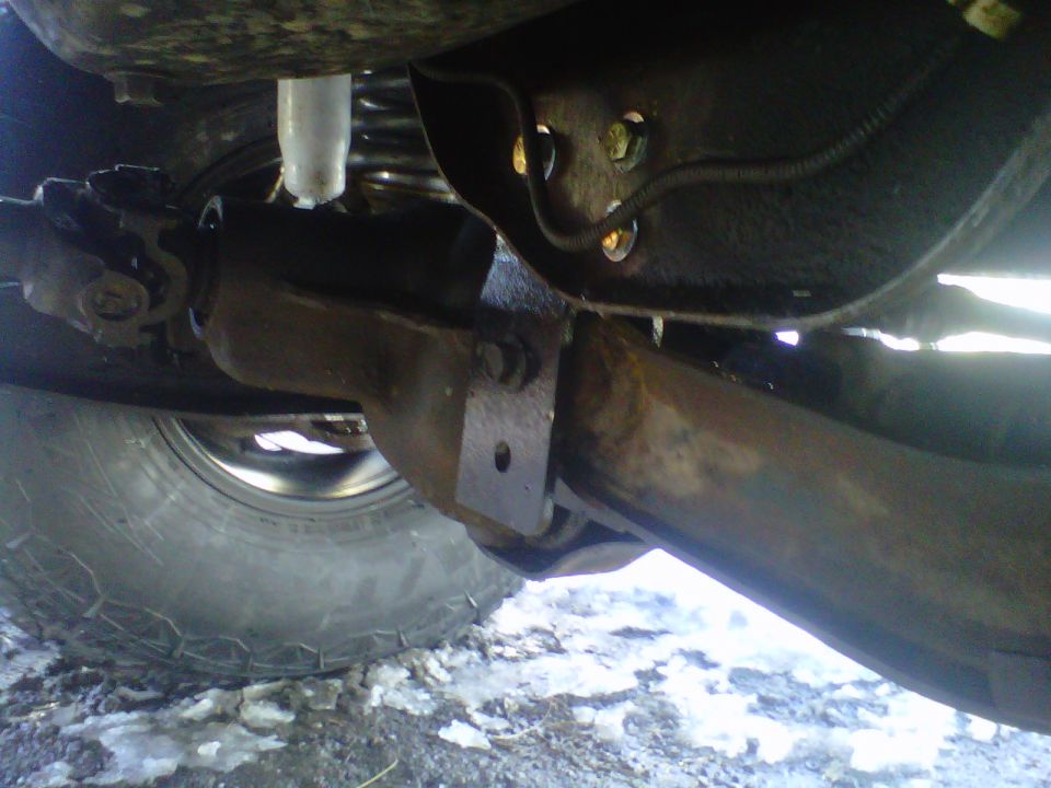 1994 Ford F-150 undercarriage with suspension and tire visible