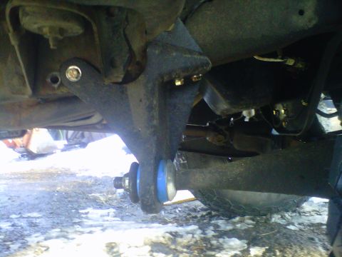 1994 Ford F-150 - Close-up view of a suspension component, likely a control arm bushing, on a truck.