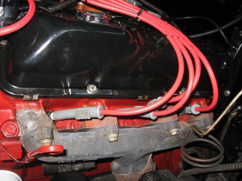 1966 Ford F-100 - Engine spark plug wires and exhaust manifold detail.
