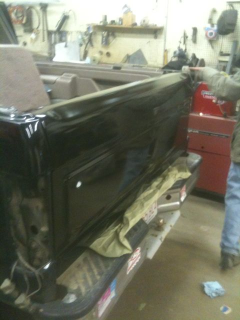 1993 Ford Bronco - Tailgate of a 1993 Ford Bronco in a workshop setting.