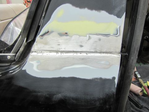 1993 Ford Bronco - Body panel repair in progress, showing areas filled and sanded.