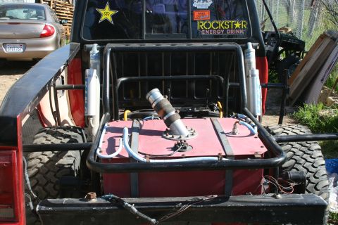1992 Ford Ranger - Pickup truck modified with a large auxiliary fuel tank and roll cage, a Rockstar Energy Drink sticker.