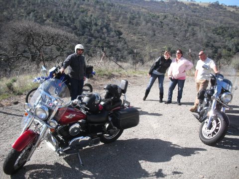1991 Ford Bronco - Group of people and their motorcycles on a scenic dirt road.