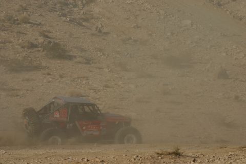 1992 Jeep Wrangler - A custom-built off-road buggy navigates a dusty desert course.