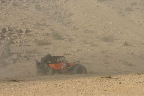 1992 Jeep Wrangler - Off-road buggy navigates a dusty desert course during an event.