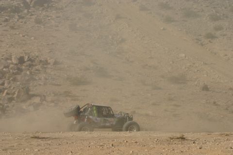 1992 Jeep Wrangler - Buggy navigates dusty desert terrain during an off-road event.