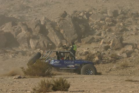 1992 Jeep Wrangler - A buggy navigates a dusty, rocky course during a race.