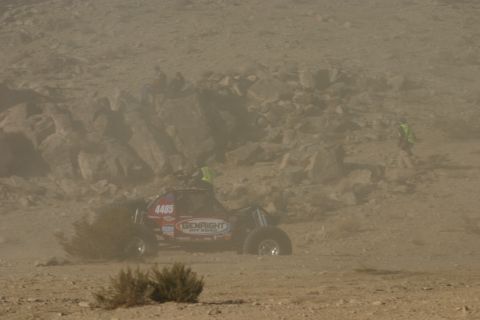 1992 Jeep Wrangler - Off-road buggy kicks up dust while racing in a desert environment.