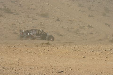 1992 Jeep Wrangler - Off-road buggy navigates a dusty desert course during an event.