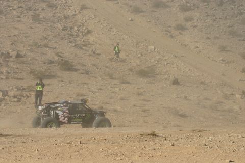 1992 Jeep Wrangler - A lone off-road buggy navigates a dusty desert terrain during a race event.