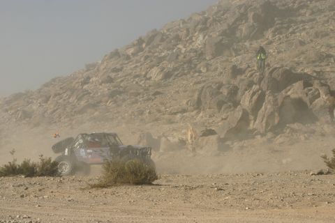 1992 Jeep Wrangler - A custom off-road buggy navigates a dusty desert course during an event.