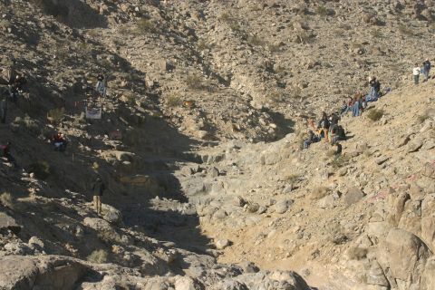 1992 Jeep Wrangler - Crowd observes an off-road race course carved into a desert mountainside.
