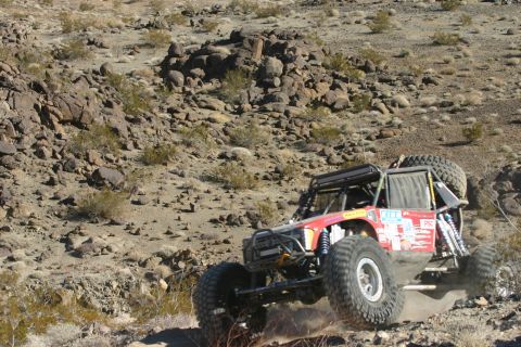 1992 Jeep Wrangler - Custom off-road buggy tackles a challenging desert course during an event.