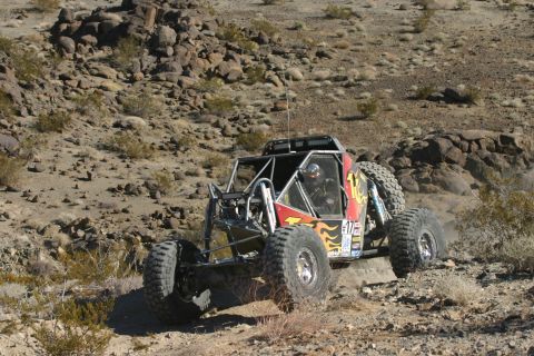 1992 Jeep Wrangler - Custom off-road buggy navigates a rocky desert course during an event.