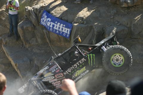 1992 Jeep Wrangler - A custom-built off-road buggy navigates a challenging rocky terrain during a competition.
