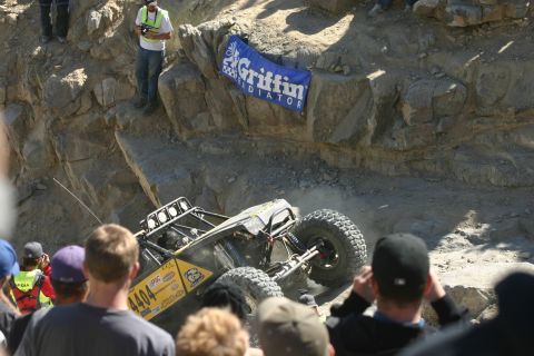 1992 Jeep Wrangler - An off-road buggy navigates a challenging rocky terrain during an event.