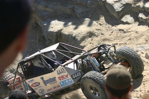 1992 Jeep Wrangler - This custom-built buggy navigates a challenging off-road course, its suspension and tire grip.
