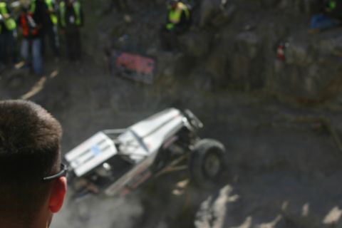 1992 Jeep Wrangler - An off-road buggy navigates a challenging rocky terrain during an event.