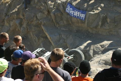 1992 Jeep Wrangler - Spectators observe an off-road vehicle navigating a challenging rocky course.