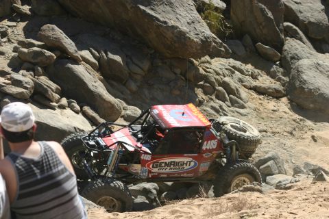 1992 Jeep Wrangler - A custom-built off-road buggy navigates a challenging rocky course during a competition.