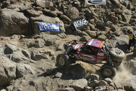 1992 Jeep Wrangler - A custom-built off-road buggy navigates a rocky course during an event.