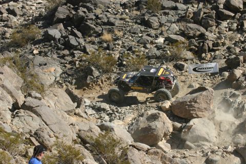 1992 Jeep Wrangler - Buggy tackles a challenging rock climb during an off-road event.