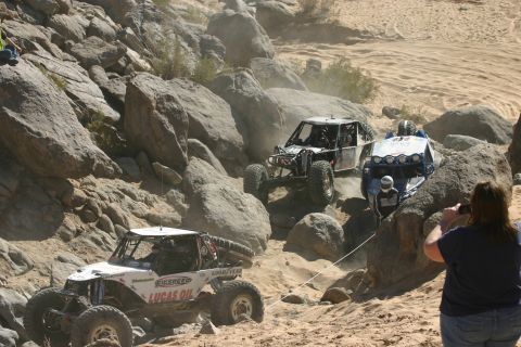 1992 Jeep Wrangler - Off-road vehicles tackle a challenging course in a desert environment. Multiple vehicles are in action.