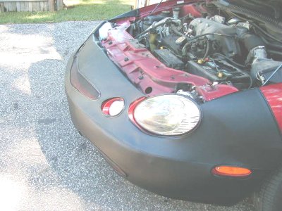 1997 Ford Taurus - Front view of a 1997 Ford Taurus showing the engine and fender with a car bra.