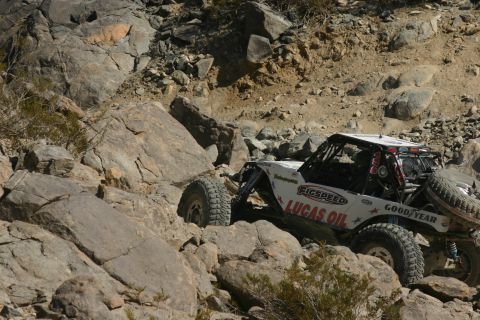 1992 Jeep Wrangler - A custom off-road buggy tackles a challenging rocky course during an event.