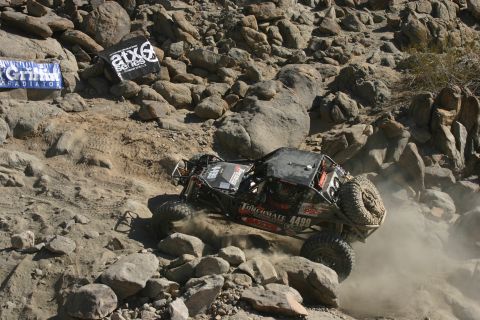 1992 Jeep Wrangler - A custom off-road buggy navigates a challenging rocky course during a competition.