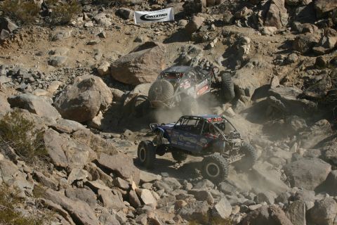 1992 Jeep Wrangler - Off-road vehicles navigate a challenging rocky terrain during an event.