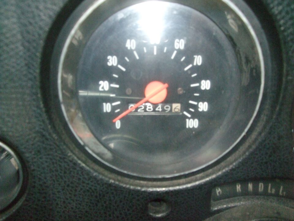 Speedometer and odometer showing 28496 miles