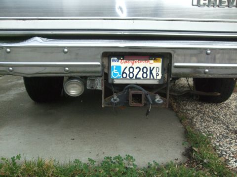 1979 Ford Bronco - Vehicle rear bumper with trailer hitch and California license plate visible.