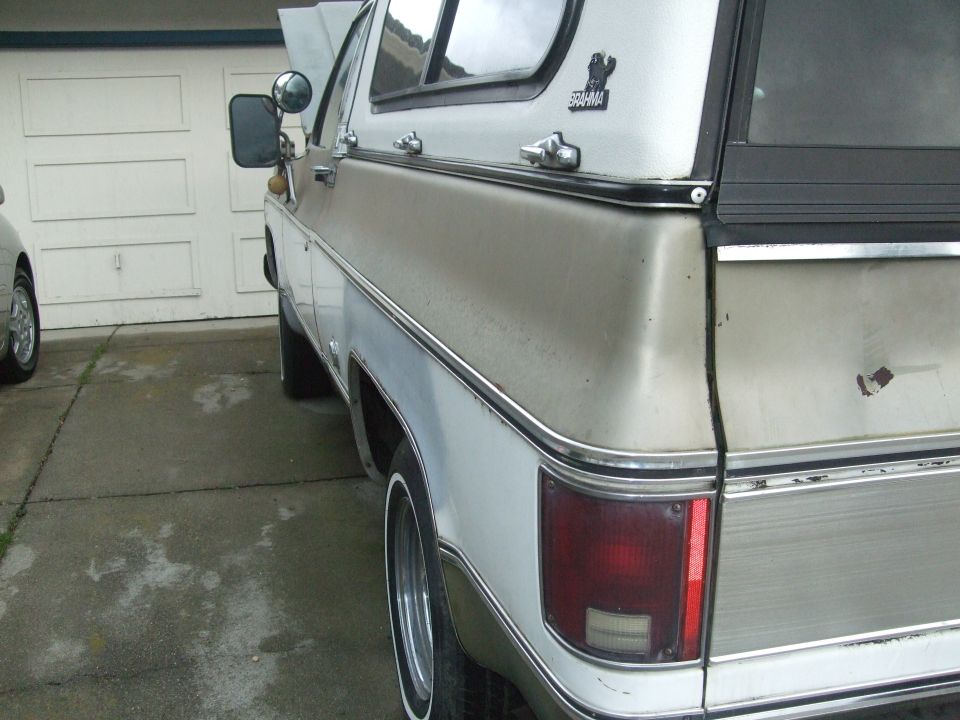 Rear quarter view of a two-tone 1979 Chevrolet K5 Blazer with hood up