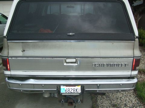 1979 Ford Bronco - This Chevrolet SUV's rear is visible, showing its tailgate, bumper, and license plate.