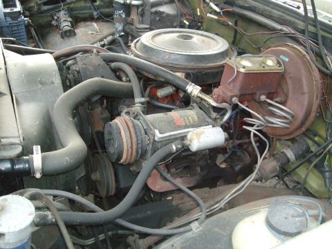 1979 Ford Bronco - Close-up view of a vehicle's engine compartment, showing various mechanical parts and wiring.