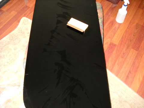 1993 Ford C-150 (Centurion Conversions) - Supplies for applying window tint are laid out on a surface, ready for use.