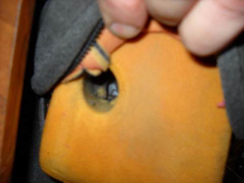 1993 Ford C-150 (Centurion Conversions) - A close-up view of the interior of a vehicle seat, showing orange foam and black fabric.