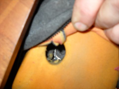 1993 Ford C-150 (Centurion Conversions) - Detail of an armrest showing foam padding and a screw head, likely from a vehicle interior.
