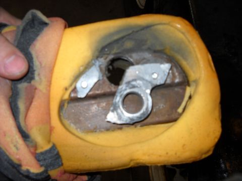 1993 Ford C-150 (Centurion Conversions) - Interior car seat part, likely an armrest mechanism, showing foam and metal components.