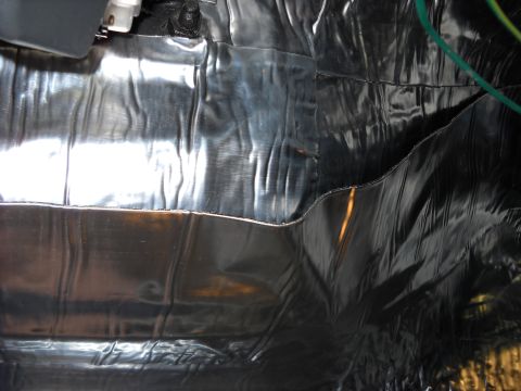 1993 Ford C-150 (Centurion Conversions) - The interior of the vehicle is covered in reflective insulation material.