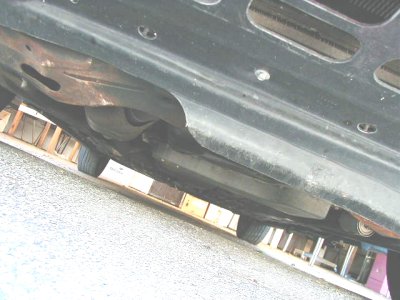 1997 Ford Taurus - Underside view of a vehicle, showing exhaust system and suspension parts.
