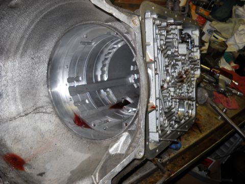 1993 Ford C-150 (Centurion Conversions) - Close-up view of a transmission valve body, likely during a rebuild or repair process.
