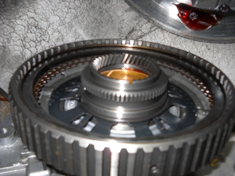 Close-up of a transmission component with gears and fluid